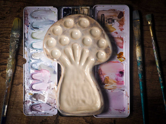 Each artist paint palette by Idania Salcido, the artist behind Danita Art, is hand sculpted and fired with paint and scratch resistant glazes and with enough paint wells to keep and mix colors at ease. Acrylics, Oils and watercolors can be used, it is perfect for any medium! Clean with water or mineral spirits.