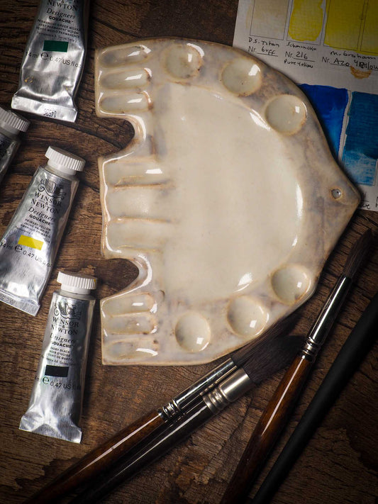 Each artist paint glazed ceramic palette by Idania Salcido, the artist behind Danita Art, is hand sculpted and fired with paint and scratch resistant glazes and with enough paint wells to keep and mix colors at ease. Acrylics, Oils and watercolors can be used, it is perfect for any medium! Clean with water or mineral spirits.