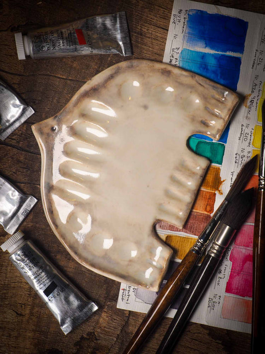 Each artist paint glazed ceramic palette by Idania Salcido, the artist behind Danita Art, is hand sculpted and fired with paint and scratch resistant glazes and with enough paint wells to keep and mix colors at ease. Acrylics, Oils and watercolors can be used, it is perfect for any medium! Clean with water or mineral spirits.