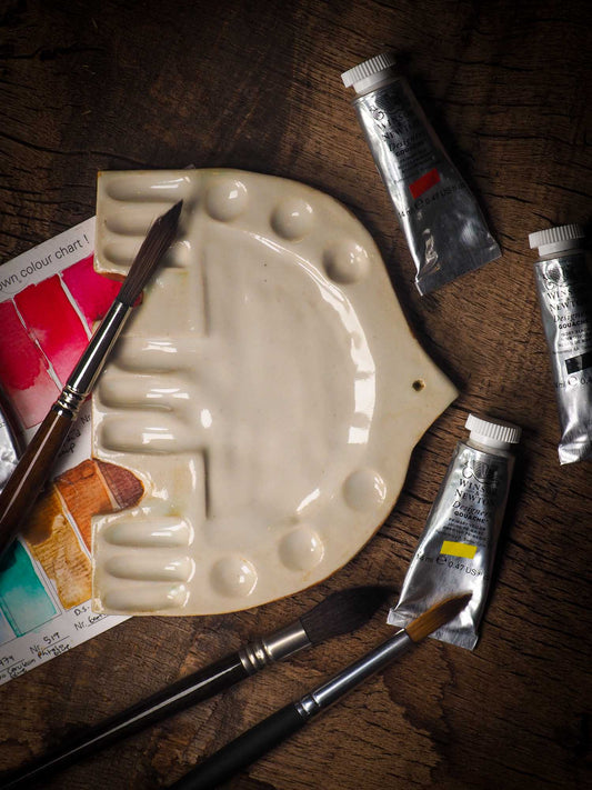 Each artist paint glazed ceramic palette by Idania Salcido, the artist behind Danita Art, is hand sculpted and fired with paint and scratch resistant glazes and with enough paint wells to keep and mix colors at ease. Acrylics, Oils and watercolors can be used, it is perfect for any medium! Clean with water or mineral spirits.