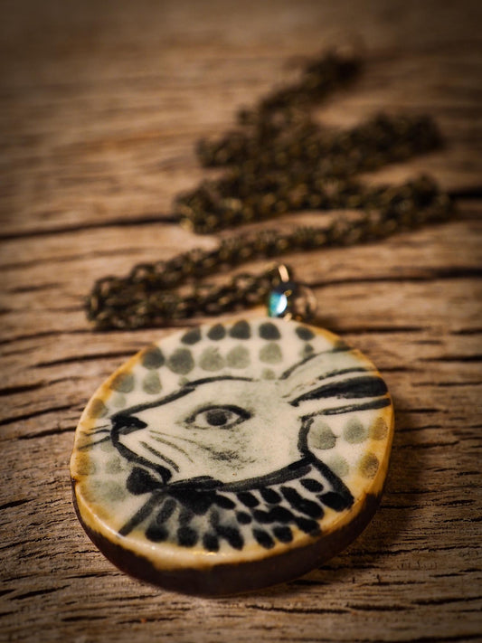 Unique fired ceramic porcelain necklace oval pendant by Idania Salcido, the artist behind Danita Art. Each jewelry setting is hand drawn and illustrated by the artist in her art studio, perfect for any dressing style. A casual gathering with friends or a fancy formal dinner, this necklace is a perfect fashion accessory.