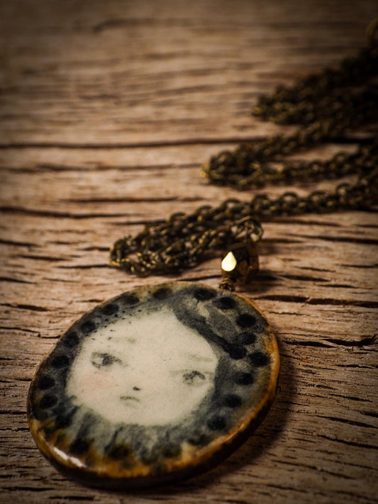 Unique fired ceramic porcelain necklace oval pendant by Idania Salcido, the artist behind Danita Art. Each jewelry setting is hand drawn and illustrated by the artist in her art studio, perfect for any dressing style. A casual gathering with friends or a fancy formal dinner, this necklace is a perfect fashion accessory.