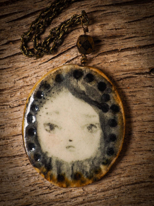 Unique fired ceramic porcelain necklace oval pendant by Idania Salcido, the artist behind Danita Art. Each jewelry setting is hand drawn and illustrated by the artist in her art studio, perfect for any dressing style. A casual gathering with friends or a fancy formal dinner, this necklace is a perfect fashion accessory.