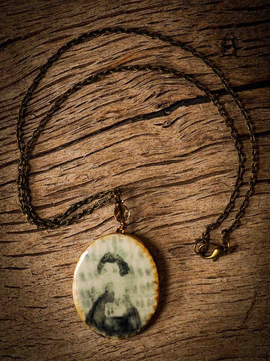 Unique fired ceramic porcelain necklace oval pendant by Idania Salcido, the artist behind Danita Art. Each jewelry setting is hand drawn and illustrated by the artist in her art studio, perfect for any dressing style. A casual gathering with friends or a fancy formal dinner, this necklace is a perfect fashion accessory.