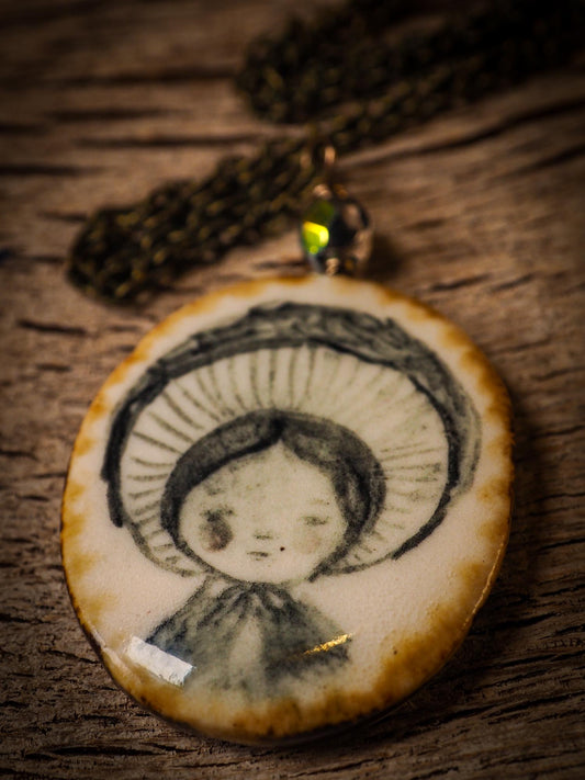 Unique fired ceramic porcelain necklace oval pendant by Idania Salcido, the artist behind Danita Art. Each jewelry setting is hand drawn and illustrated by the artist in her art studio, perfect for any dressing style. A casual gathering with friends or a fancy formal dinner, this necklace is a perfect fashion accessory.