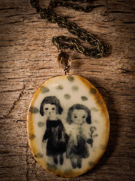 Unique fired ceramic porcelain necklace oval pendant by Idania Salcido, the artist behind Danita Art. Each jewelry setting is hand drawn and illustrated by the artist in her art studio, perfect for any dressing style. A casual gathering with friends or a fancy formal dinner, this necklace is a perfect fashion accessory.