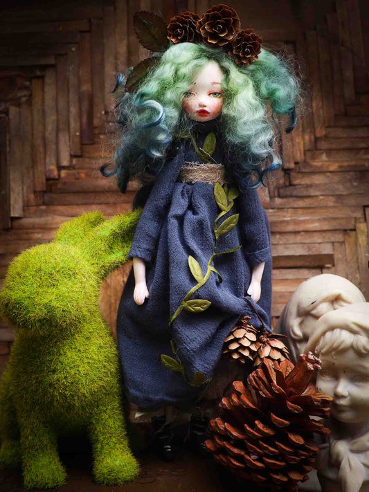 Original Danita Art handamde doll. Gaia mother nature is represented on this handmade figurine with pine cones, leaves and amazing details on her face and eyes. It is a perfect fantasy figurine gift.