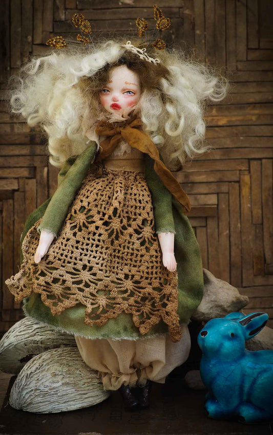 An original Danita handmade art doll, inspired by the sounds and smells of the Autumn forest, dry leaves and the colorful scenery of Mother Nature.  Her name is TERRA, goddess of the earth and home to all of us. She is dressed in a beautiful hand made green dress and a brown lace apron that represent the life giving power of earth and plants.