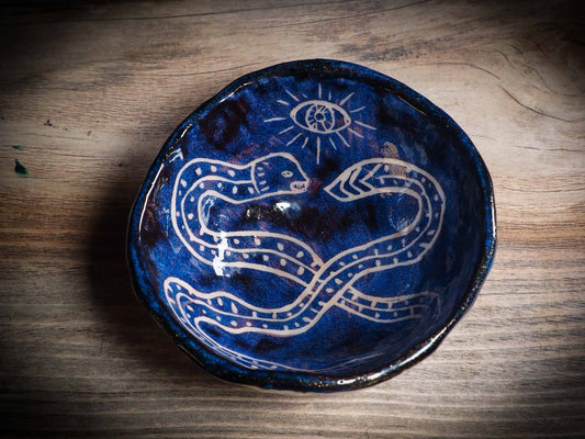 An original Halloween ceramic mug tumbler bowl handmade by Idania Salcido the artist behind Danita Art. Made with wheel thrown clay hand carved and glazed by the artist. Witches, ghosts, goblins, black cats, vampires give a folk art primitive feel to it. Perfect for Halloween Candy, ice cream and fruit, a pet cat bowl.