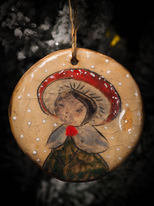 An original Christmas Holiday tree round glazed ceramic ornament handmade by Idania Salcido, the artist behind Danita Art. Glazed carved sgraffito stoneware, hand painted and decorated, it is illustrated by hand with snowmen, Christmas trees, Santa Claus, angels and snow balls and winter themes.