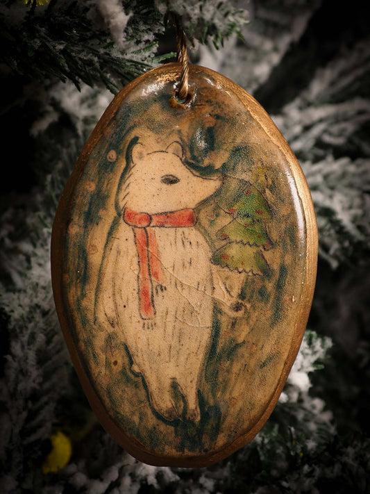 An original Christmas Holiday tree round glazed ceramic ornament handmade by Idania Salcido, the artist behind Danita Art. Glazed carved sgraffito stoneware, hand painted and decorated, it is illustrated by hand with snowmen, Christmas trees, Santa Claus, angels and snow balls and winter themes.