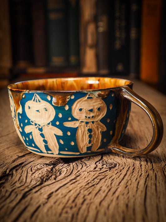 An original Christmas fire glazed ceramic handmade piece by Idania Salcido, the artist behind Danita Art. Glazed, carved sgraffito stoneware, hand painted and decorated, it is illustrated by hand with snowmen, Christmas trees, Santa Claus, angels and snow balls and winter themes.