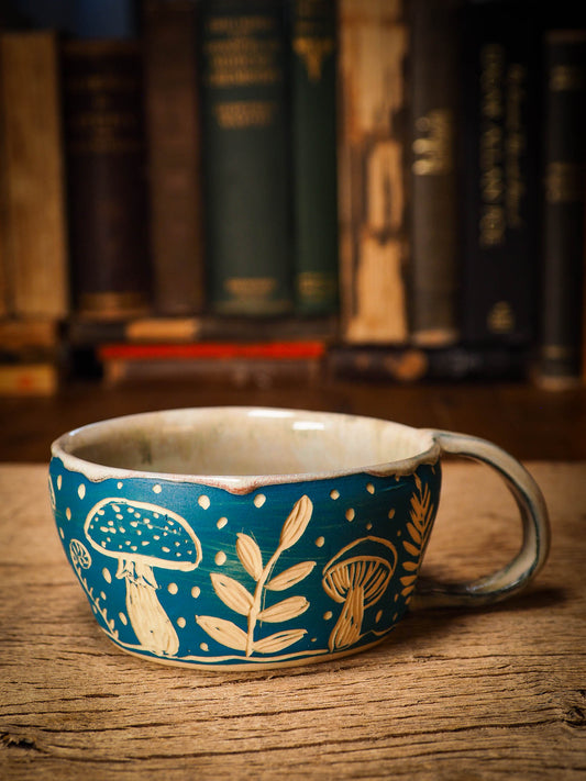 An original Christmas fire glazed ceramic handmade piece by Idania Salcido, the artist behind Danita Art. Glazed, carved sgraffito stoneware, hand painted and decorated, it is illustrated by hand with snowmen, Christmas trees, Santa Claus, angels and snow balls and winter themes.