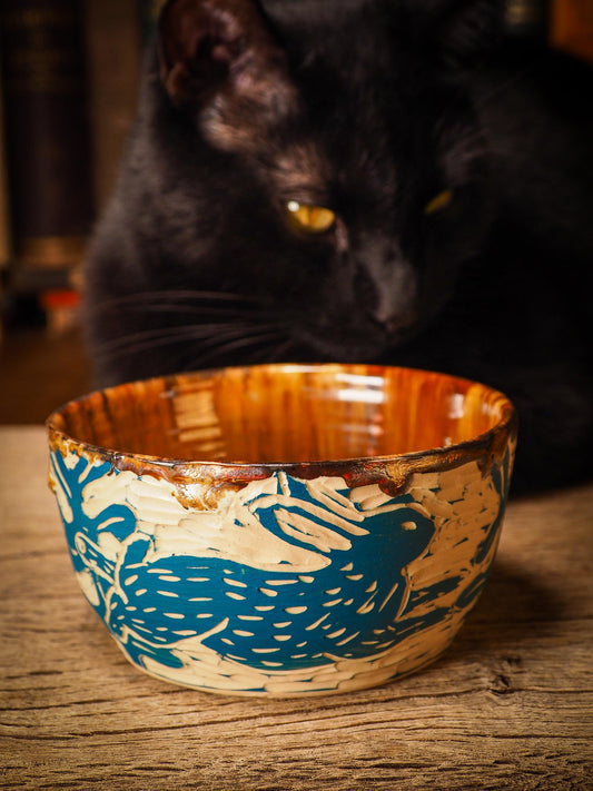 An original Christmas fire glazed ceramic handmade piece by Idania Salcido, the artist behind Danita Art. Glazed, carved sgraffito stoneware, hand painted and decorated, it is illustrated by hand with snowmen, Christmas trees, Santa Claus, angels and snow balls and winter themes.