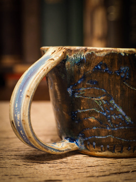 An original Christmas fire glazed ceramic handmade piece by Idania Salcido, the artist behind Danita Art. Glazed, carved sgraffito stoneware, hand painted and decorated, it is illustrated by hand with snowmen, Christmas trees, Santa Claus, angels and snow balls and winter themes.