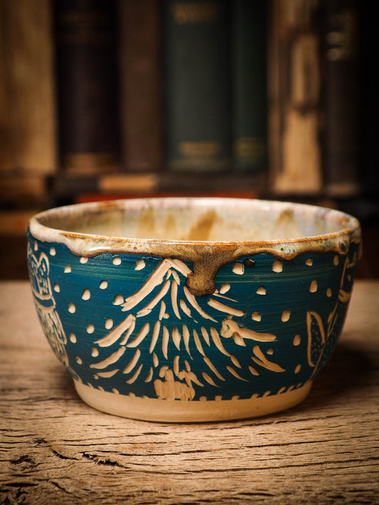 An original Christmas fire glazed ceramic handmade piece by Idania Salcido, the artist behind Danita Art. Glazed, carved sgraffito stoneware, hand painted and decorated, it is illustrated by hand with snowmen, Christmas trees, Santa Claus, angels and snow balls and winter themes.