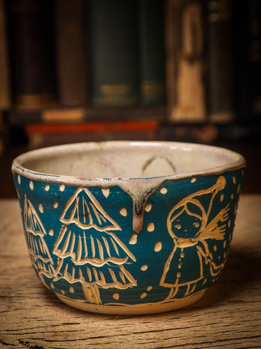 An original Christmas fire glazed ceramic handmade piece by Idania Salcido, the artist behind Danita Art. Glazed, carved sgraffito stoneware, hand painted and decorated, it is illustrated by hand with snowmen, Christmas trees, Santa Claus, angels and snow balls and winter themes.